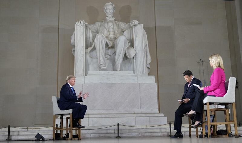 U.S. President Donald Trump participates in a live Fox News Channel virtual town hall called 'America Together: Returning to Work' with with hosts Bret Baier and Martha MacCallum about the response to the coronavirus disease being broadcast from inside the Lincoln Memorial in Washington. Reuters