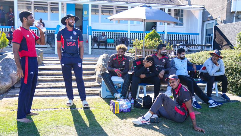 USA and UAE players share a laugh during the delay due to sightscreen issues. 