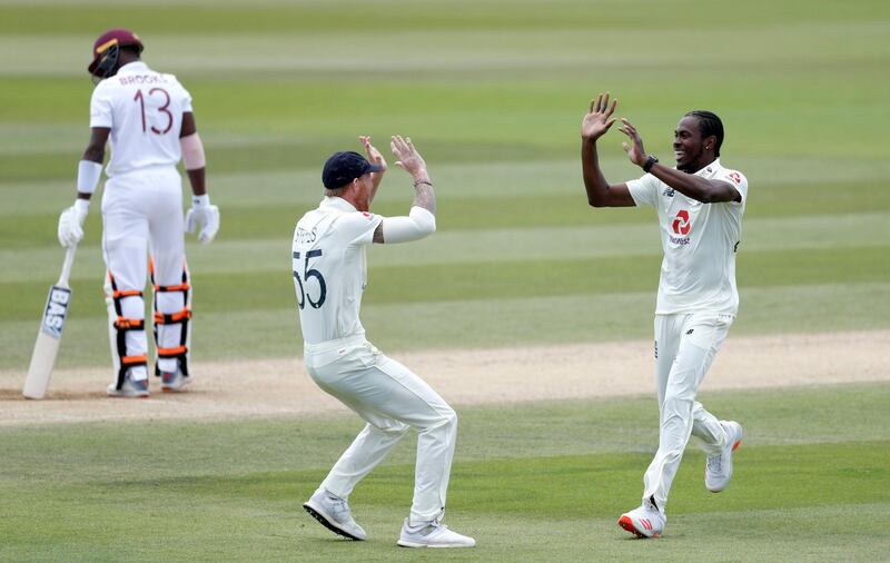 England's Jofra Archer celebrates taking the wicket of West Indies' Shamarh Brooks with team-mate Ben Stokes during day five of the Test Series at the Ageas Bowl, Southampton. PA