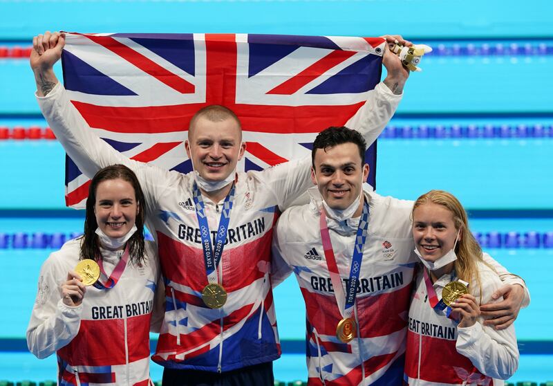 Great Britain's Kathleen Dawson, Adam Peaty, James Guy, and Anna Hopkin with their gold medals in the mixed 4 x 100m medley relay.