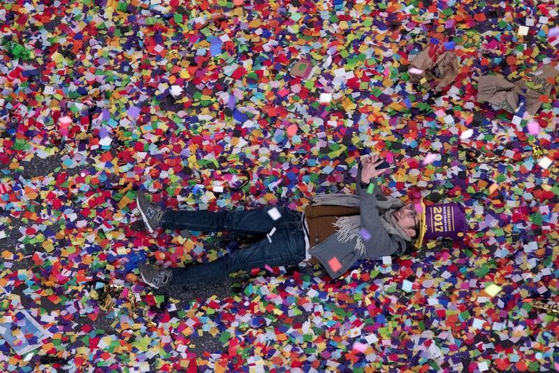 A reveller takes a selfie in the confetti during the new year celebration in New York’s Times Square. Mary Altaffer / AP Photo