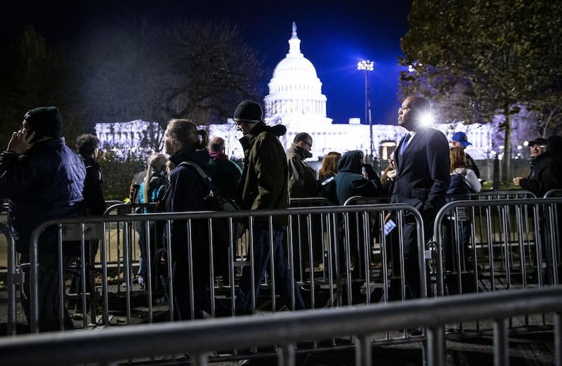 People wait in line to view former US President George HW Bush as he lies in state. Bloomberg