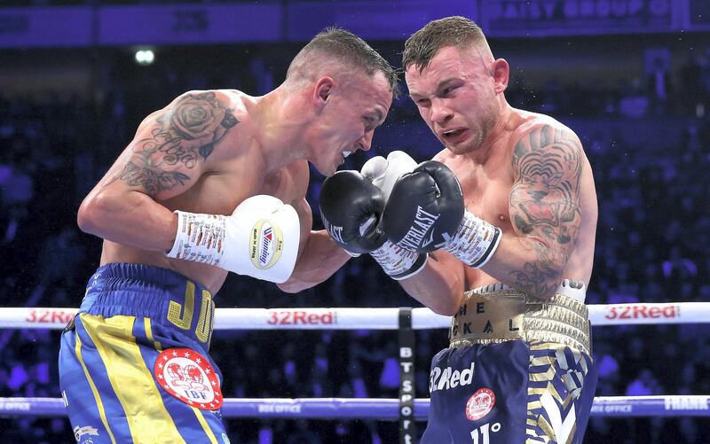 MANCHESTER, ENGLAND - DECEMBER 22:  Josh Warrington and Carl Frampton exchange punches during the IBF World Featherweight Championship title fight between Josh Warrington and Carl Frampton at Manchester Arena on December 22, 2018 in Manchester, England.  (Photo by Alex Livesey/Getty Images)