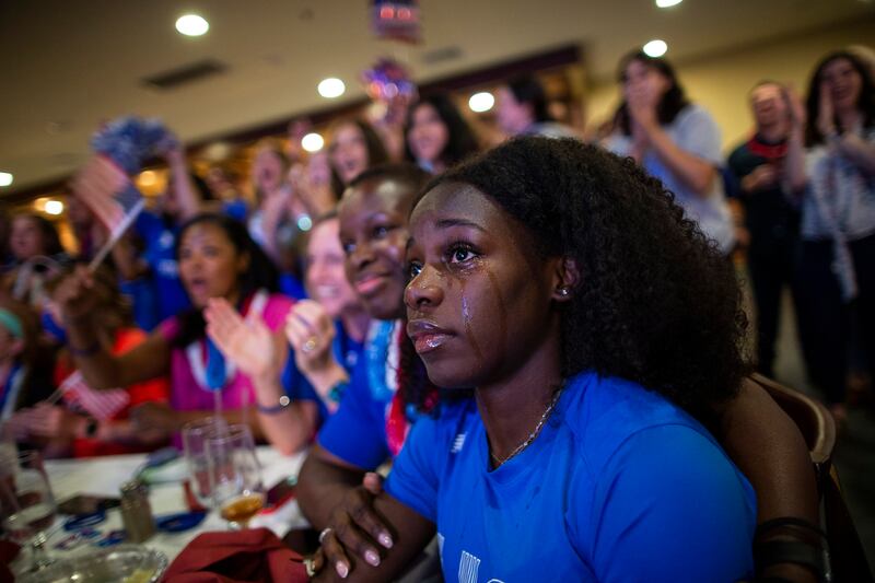 Ashleigh Patterson, 19, cries as she and others watch Sydney McLaughlin in the finals of the 400-meter hurdles at the Tokyo Olympics during a watch party in Mountainside, New Jersey.