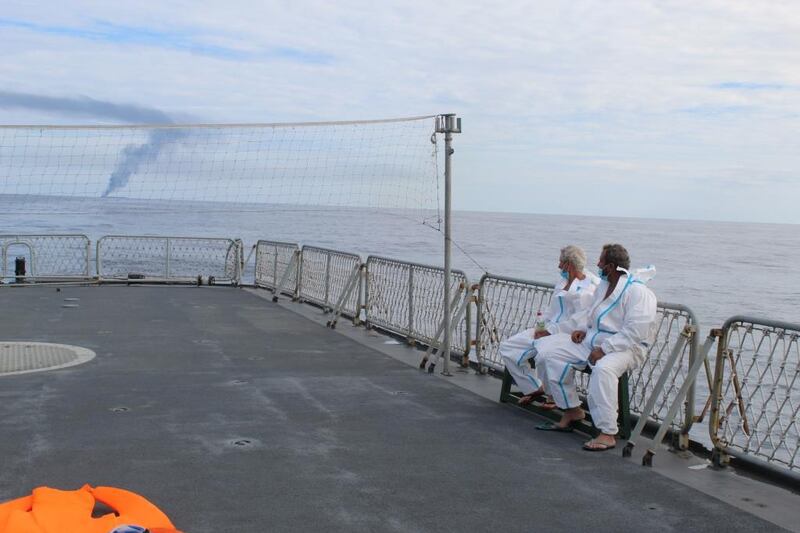 Crew members aboard a navy boat after being rescued from the MT New Diamond. One crew member was killed and another injured in he explosion and fire aboard the tanker. Reuters