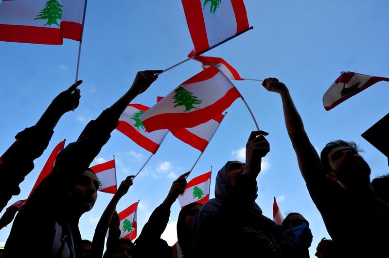 Anti-government protesters wave national flags during a protest called by member of Parliament Chamel Roukoz, the son-in-law of Lebanese President Michel Aoun, at Martyrs' Square in Beirut, Lebanon. EPA