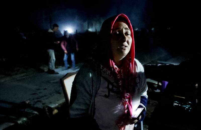 People react after an earthquake in Antakya in Hatay province, Turkey.