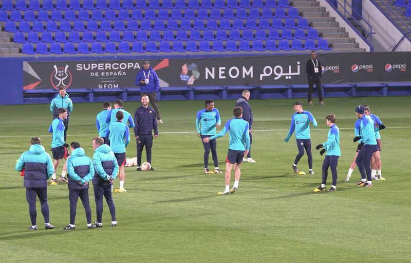 Barcelona player warmup during training. Reuters