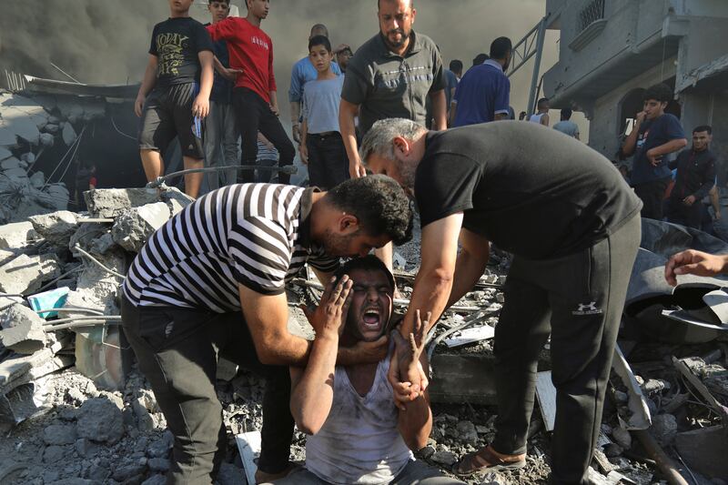 A man mourns after losing relatives following an Israeli air strike in Gaza city. AP