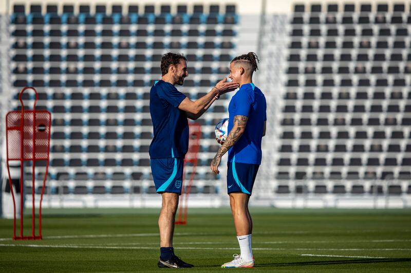 England manager Gareth Southgate talks to Kalvin Phillips. EPA