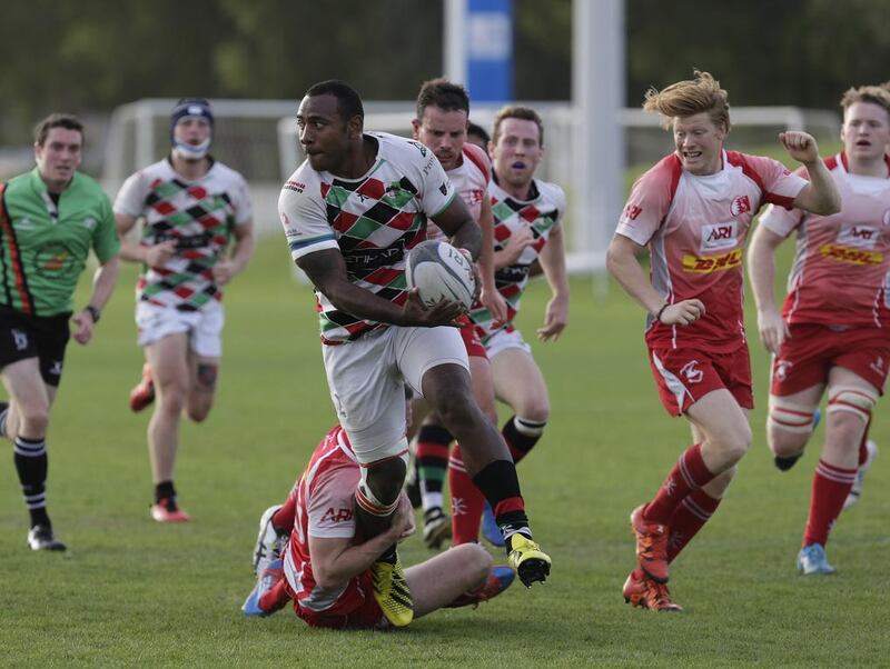 William Umu (No 12 of Abu Dhabi Harlequins)  fights through Bahrain’s defence  in a West Asia Championship match held at the Zayed Sports City on March 18.  Jeffrey E Biteng / The National