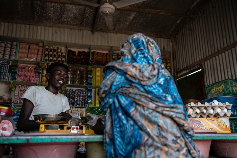 Hassan, 16, works at a market stall in Shagarab. The camp was set up in 1968 and lies about 70 kilometres west of the Eritrean border. Getty