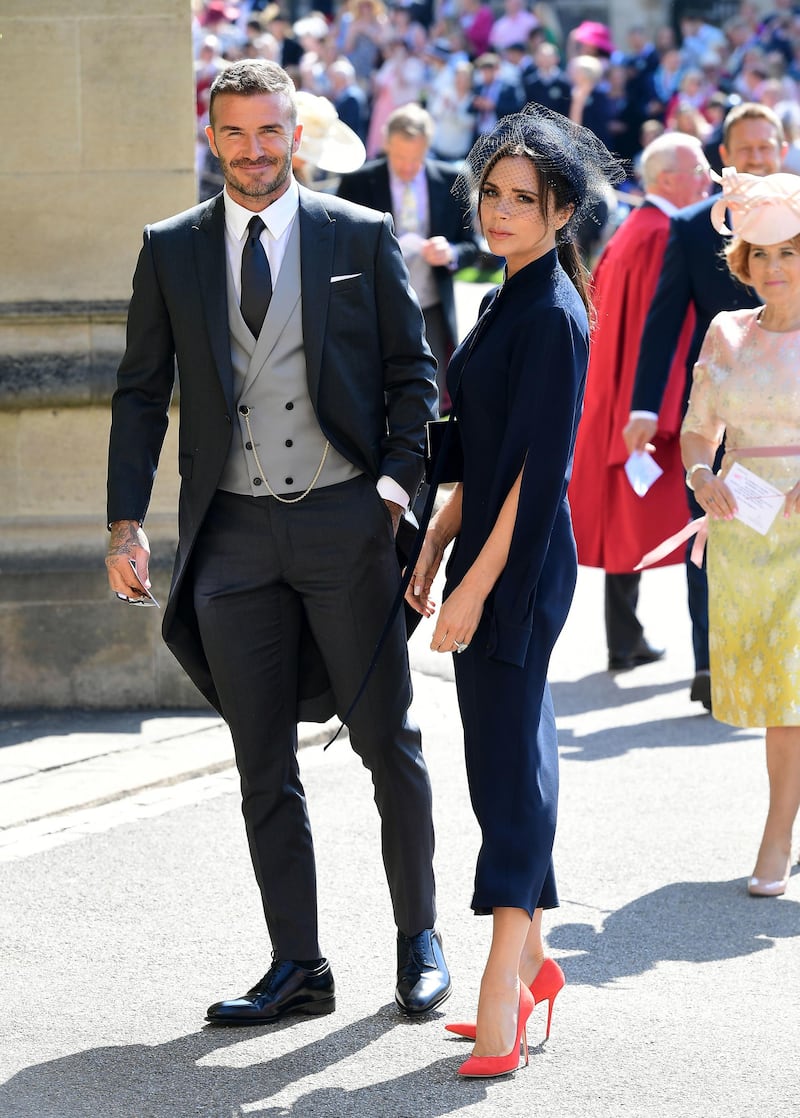 WINDSOR, UNITED KINGDOM - MAY 19: David and Victoria Beckham arrive at St George's Chapel at Windsor Castle before the wedding of Prince Harry to Meghan Markle on May 19, 2018 in Windsor, England. (Photo by Ian West - WPA Pool/Getty Images)