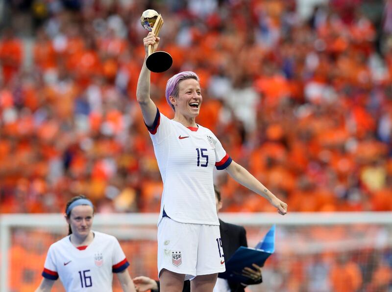 Megan Rapinoe, who scored the opening goal for the US, lifts the Fifa Women's World Cup. AP Photo