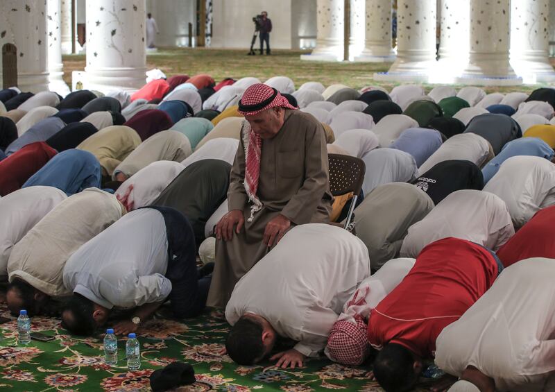 Muslims take part in evening prayers at the mosque


