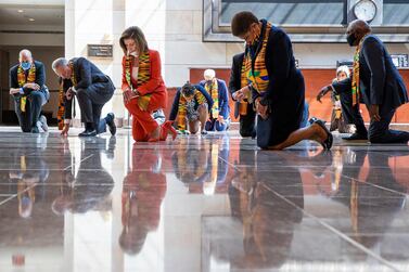 House Speaker Nancy Pelosi and other Democrats kneel in the Emancipation Hall before presenting a bill on police reforms in the US Congress on June 8, 2020. AP Photo