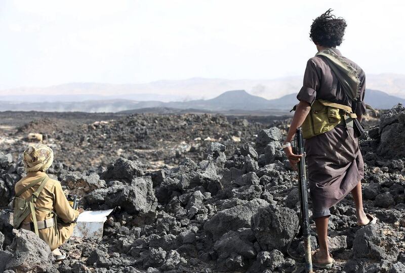 Militiamen loyal to Yemen's exiled government take up a position during fighting with Houthi rebels in Marib province on September 13, 2015. Stringer/Reuters