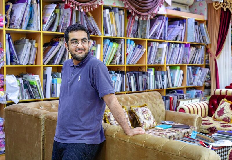 Abu Dhabi, United Arab Emirates, July 17, 2019.  Vendors of Al Mina Photo Project.  Al Mina Souk Market -- Saber-21.  The youngest manager of the Persian carpets and rug store, Dar Al Ain Furnishing at the Souk.
Victor Besa/The National
Section:  NA
Reporter: