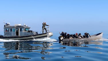 Tunisian coastguard officials intercept migrants at sea during their dangerous attempt to cross to Italy. Reuters