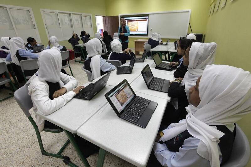Grade 7 pupils at Umm Suqeim Model School in an English class use high-technology equipment as part of the Sheikh Mohammed bin Rashid Smart Learning Programme. Jeffrey E Biteng / The National