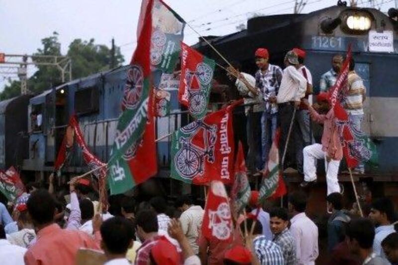Samajwadi Party activists block a railway track during a protest in Allahabad. The strike was over a government decision to open the country’s retail market to foreign companies and to reduce fuel subsidies.