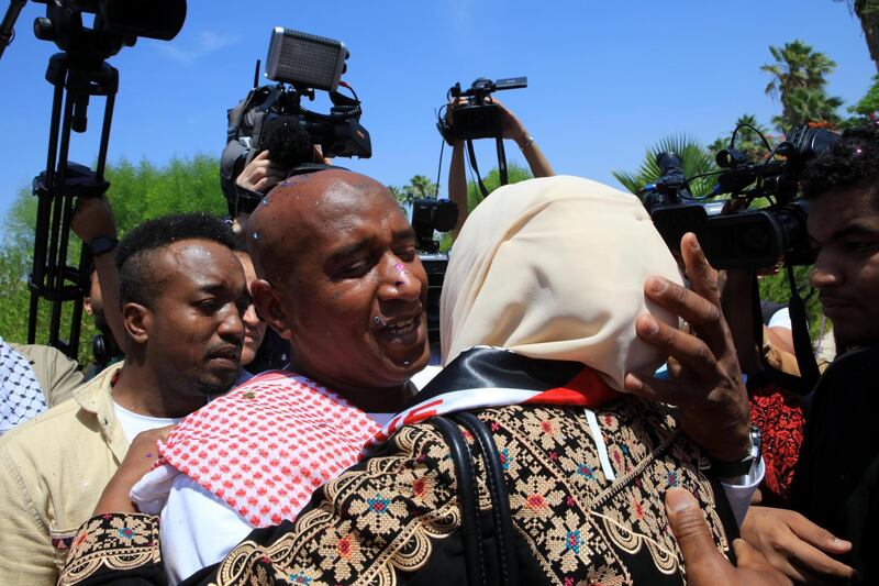 Abdullah Abu Jaber, longest serving Jordanian prisoner in Israeli jails, is welcomed after being released upon arrival at Sheikh Hussein Crossing between Israel and Jordan. EPA