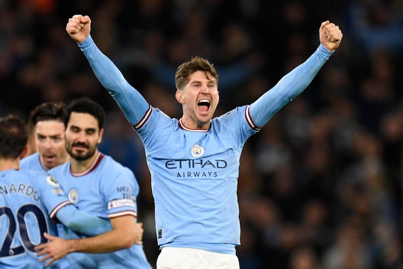John Stones celebrates scoring for Manchester City in their win over Premier League title rivals Arsenal at the Etihad Stadium on April 27, 2023. AFP