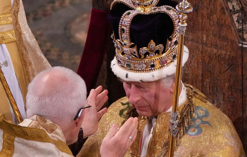 King Charles III is crowned with St Edward's Crown by the Archbishop of Canterbury during his coronation ceremony at Westminster Abbey, London. Reuters