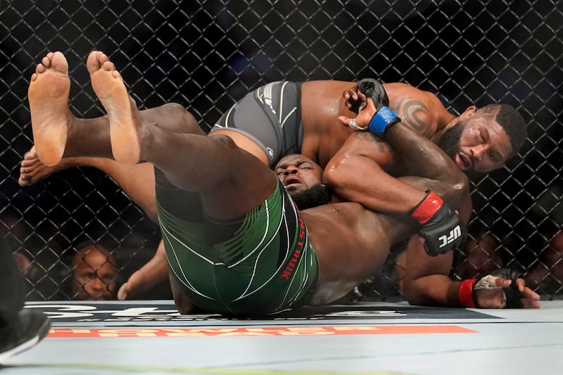 Curtis Blaydes, right, fights Jairzinho Rozenstruik during a heavyweight mixed martial arts bout at UFC 266. AP Photo
