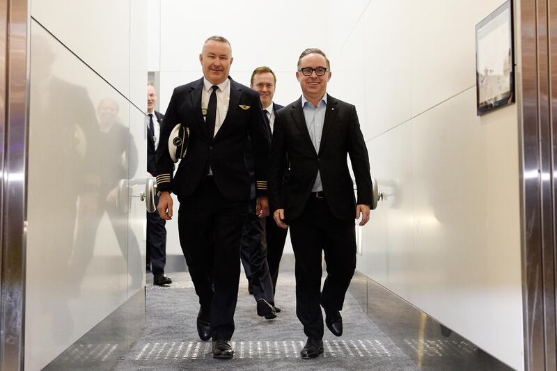 Sean Golding and Alan Joyce, right, arrive at Sydney International Airport. EPA