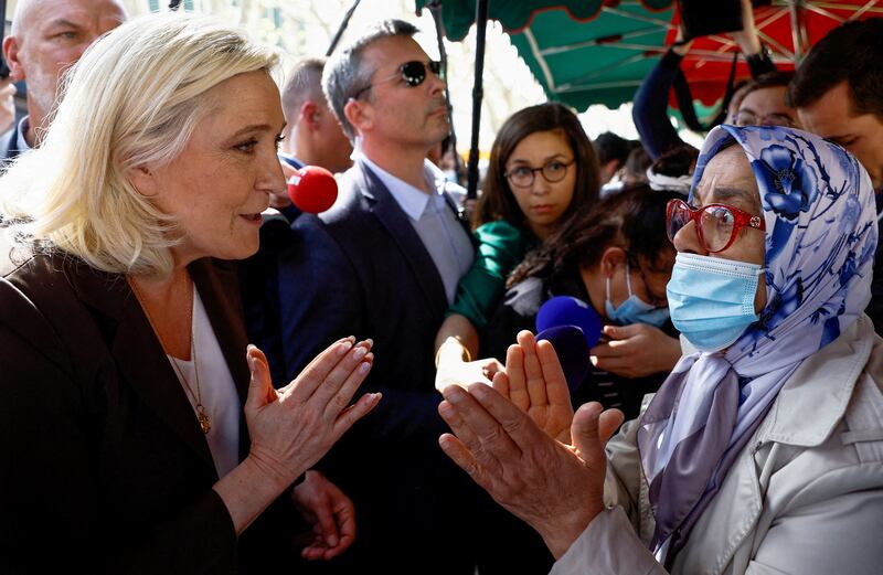 Marine Le Pen, the far-right candidate in the French presidential election, meets voters in the southern commune of Pertuis, near Marseille, on Friday. Reuters