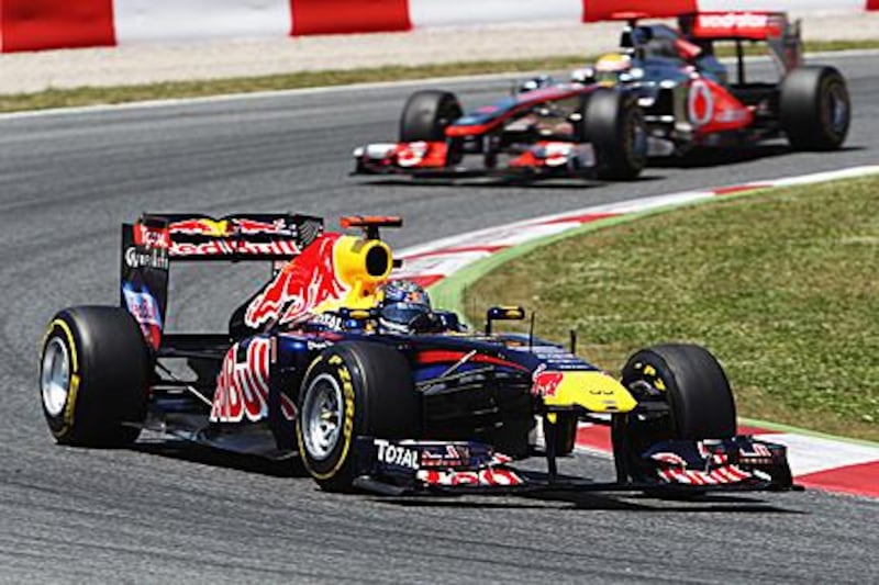 Sebastian Vettel leads Lewis Hamilton around the Circuit de Catalunya to win the Spanish Grand Prix — his fourth victory of the season.
