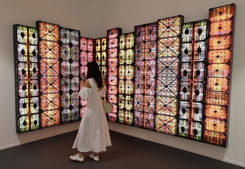 Dubai, United Arab Emirates - Reporter: Alexandra Chaves. Arts and Lifestyle. A visitor looks at a piece by Rashed Al-Shashai called Brand 14 from the Hafez Gallery in Jeddah. Art Dubai 2021 opens at the DIFC. Tuesday, March 30th, 2021. Dubai. Chris Whiteoak / The National