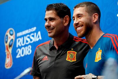 Spain's coach Hierro Fernando (L) and defender Sergio Ramos arrive for a press conference at the Fisht Olympic Stadium in Sochi on June 14, 2018, on the eve of the Russia 2018 World Cup Group B football match between Portugal and Spain. / AFP / Adrian DENNIS
