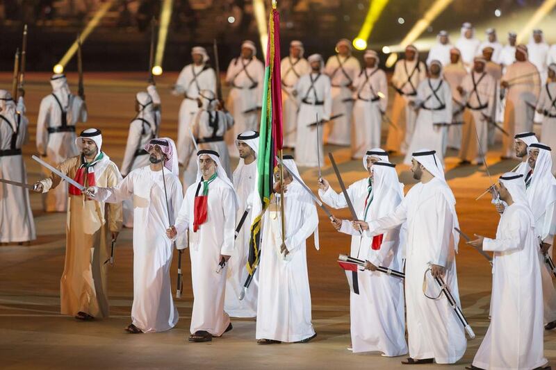 Sheikh Rashid bin Humaid (L), Sheikh Ammar bin Humaid, Crown Prince of Ajman (2nd L), Lt Gen Sheikh Saif bin Zayed, Deputy Prime Minister and Minister of Interior (3rd L), Sheikh Hamed bin Zayed, Chairman of Crown Prince Court - Abu Dhabi and Managing Director of the Abu Dhabi Investment Authority (ADIA) (R), Sheikh Nahyan bin Saif (2nd R) and other dignitaries attend the 44th UAE National Day celebrations at Zayed Sports City. Mohamed Al Hammadi / Crown Prince Court - Abu Dhabi