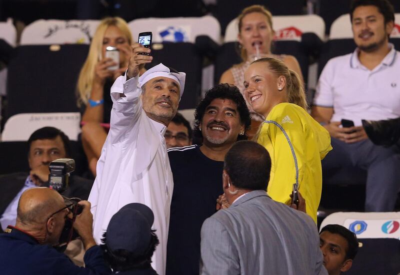 DUBAI, UNITED ARAB EMIRATES - FEBRUARY 20:  Football legend, Diego Maradona meets Caroline Wozniacki of Denmark during day three of the WTA Dubai Duty Free Tennis Championship on February 20, 2013 in Dubai, United Arab Emirates.  (Photo by Julian Finney/Getty Images) *** Local Caption ***  162205662.jpg