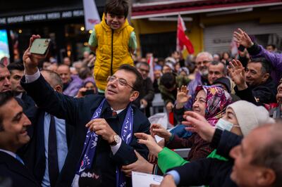 Istanbul Mayor Ekrem Imamoglu take photographs with supporters during a campaign rally in Istanbul, Turkey, before the elections. AP 