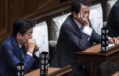 TOKYO, JAPAN - AUGUST 01: Japan's Prime Minister Shinzo Abe (L) and Deputy Prime Minister and Finance Minister Taro Aso (R) attend a plenary session at the lower house of the parliament on August 1, 2019 in Tokyo, Japan. Emperor Naruhito attended the opening of the Diet session today for the first time since he ascended to the throne in May. (Photo by Tomohiro Ohsumi/Getty Images)