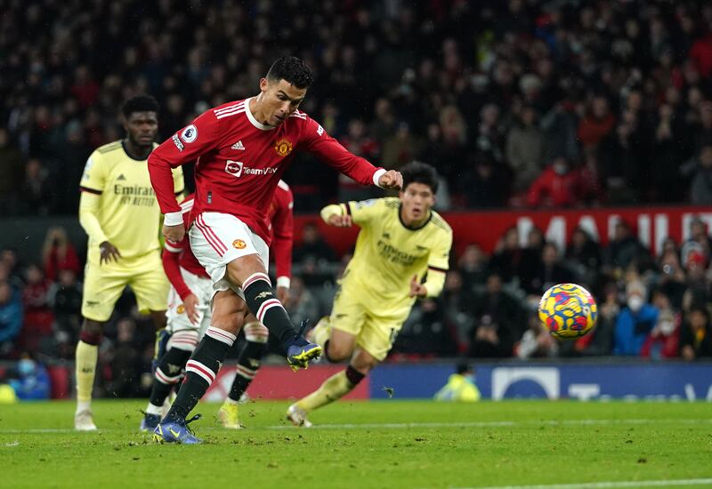 Manchester United's Cristiano Ronaldo scores a penalty during the Premier League match against Arsenal. PA