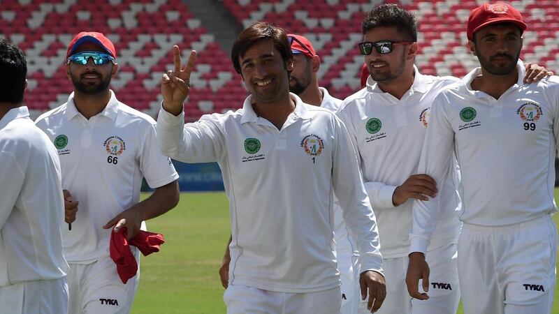 Asghar Afghan, centre, scored 50 from 122 balls for Afghanistan in their one-off test against Bangladesh on Saturday. AFP