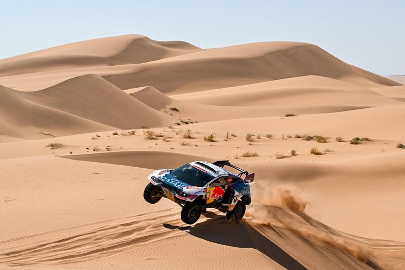 Qatari driver Nasser Al Attiyah and his French co-driver Mathieu Baumel compete during Stage 3 of the Dakar Rally 2024, between Al Duwadimi and Al Salamiya, Saudi Arabia. AFP