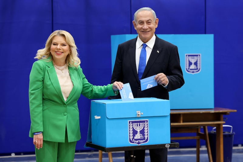 Mr Netanyahu and his wife Sara cast their ballot at a polling station in Jerusalem in the country's fifth election in less than four years. AFP
