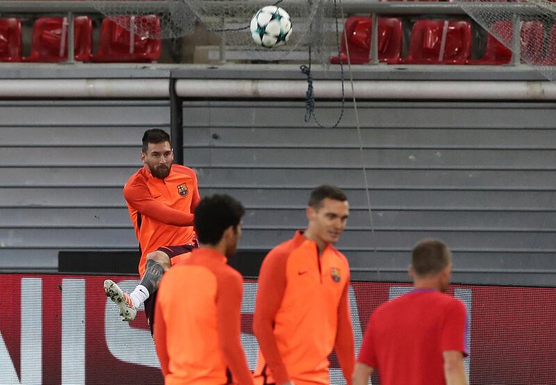 Lionel Messi, left, during a training session. Petros Giannakouris / AP Photo