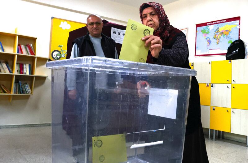 A woman casts her ballot at a polling station in Ankara. Reuters