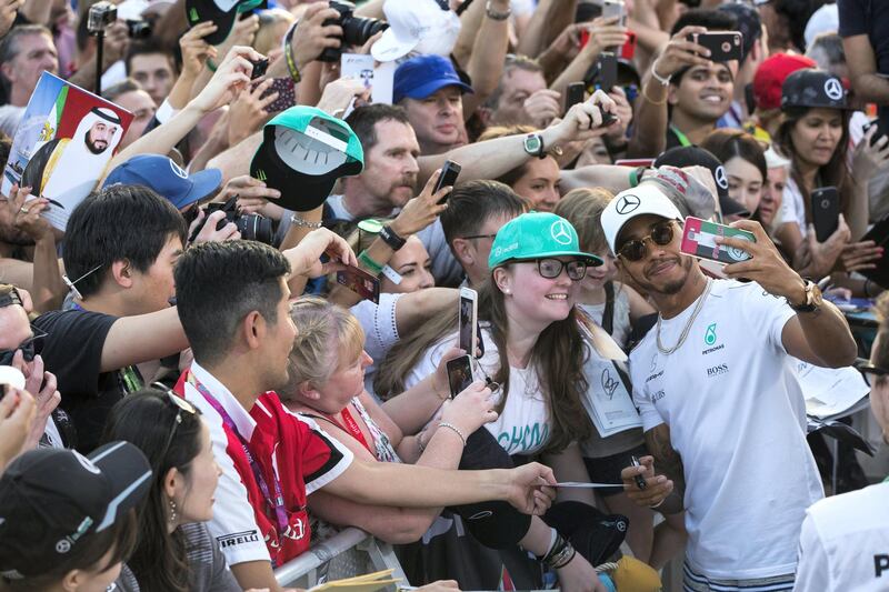 Abu Dhabi, United Arab Emirates, November 23, 2017:    Lewis HamiltonÊof Great Britain and Mercedes GP signs autographs during previews for the Abu Dhabi Formula One Grand Prix at Yas Marina Circuit in Abu Dhabi on November 23, 2017. Christopher Pike / The National

Reporter: John McAuley, Graham Caygill
Section: Sport