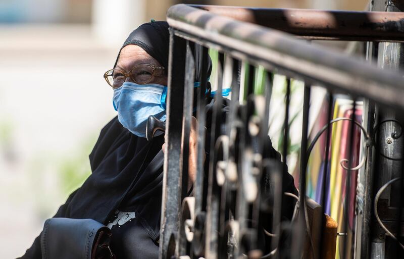 An elderly woman waits to vote.  EPA