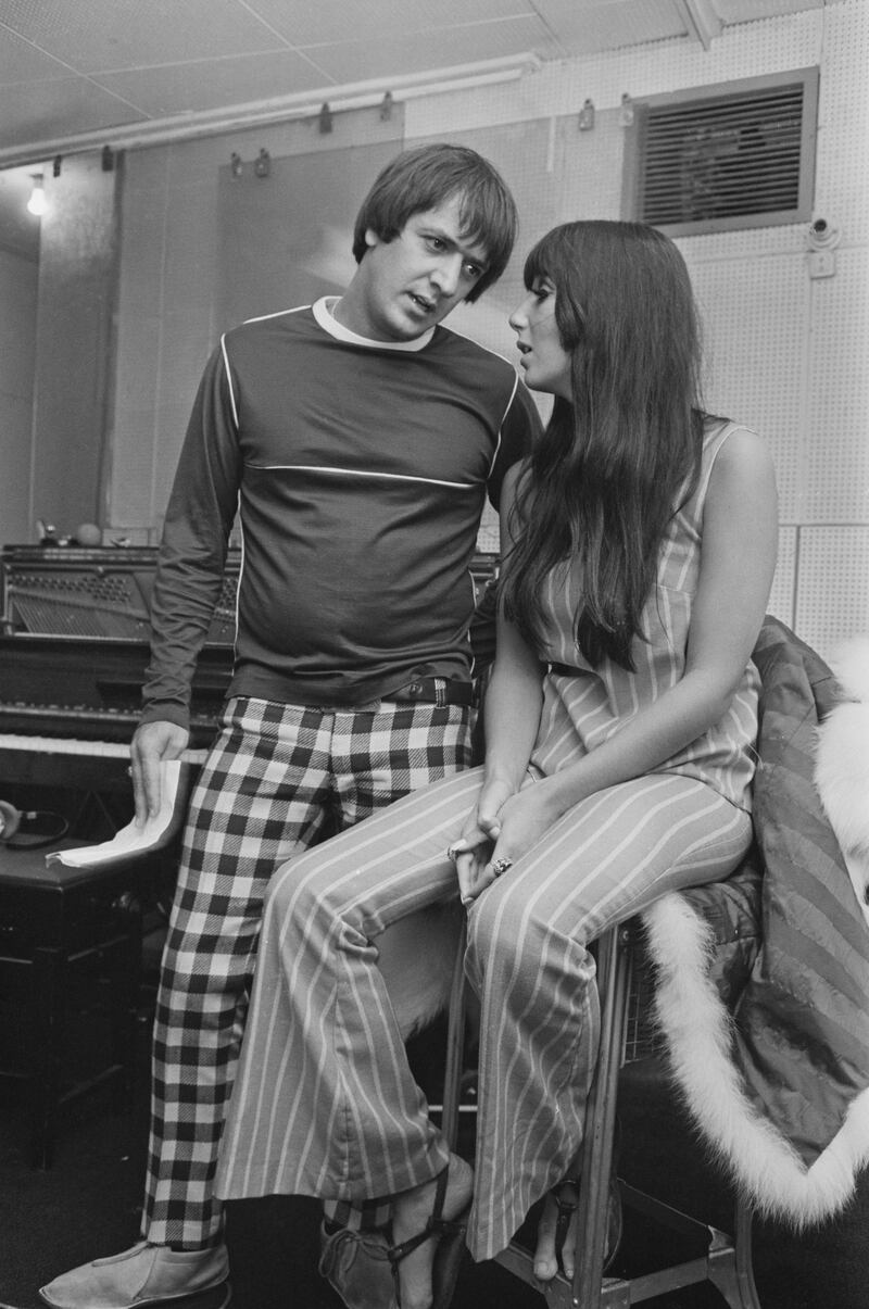 Husband and wife duo Sonny Bono (1935 - 1998) and Cher at a charity recording session in aid of the Braille Institute, 28th August 1966. (Photo by Powell/Express/Hulton Archive/Getty Images)