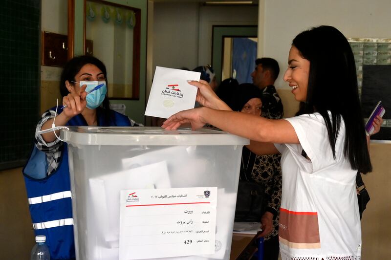 A Lebanese voter casts her ballot paper in Beirut. EPA