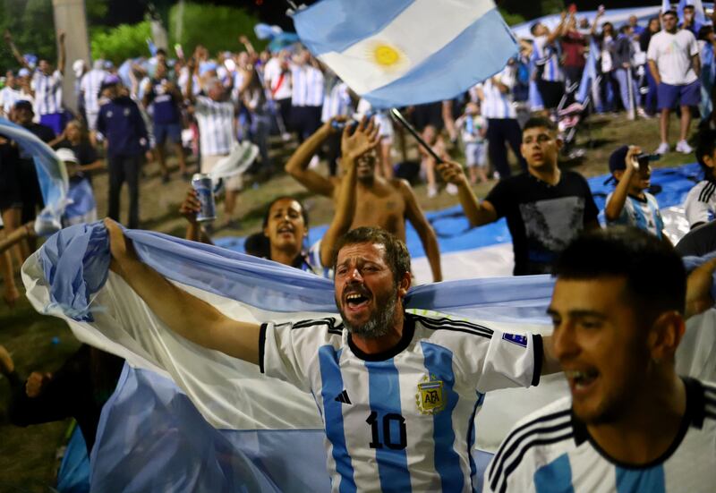 Fans gather outside of the Association of Argentinian Football Headquarters ahead of the team arrival. Reuters