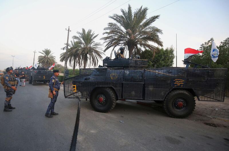 Iraqi police are seen deployed in Baghdad's predominantly Shiite Sadr City. Demonstrations across Baghdad and the south have spiralled into violence over the last week, with witnesses reporting security forces using water cannons, tear gas and live rounds and authorities saying "unidentified snipers" have shot at protesters and police. On Sunday evening a mass protest in Sadr City in east Baghdad led to clashes that medics and security forces said left 13 people dead. AFP